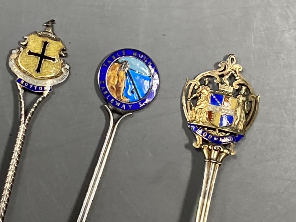 Six 20th century assorted silver and enamel souvenir spoons, gross 81 grams and five similar white metal and enamel spoons,